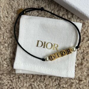 Christian Dior fashion logo bracelet.